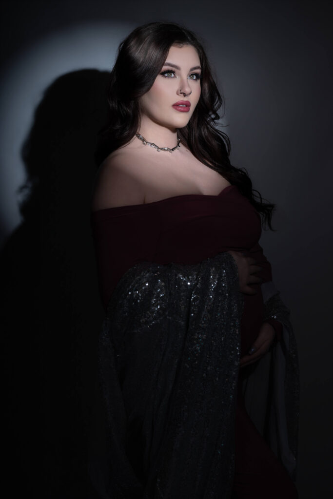 Glamorous studio portrait of pregnant woman